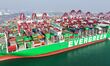 A cargo ship loads and unloads containers at Qingdao Port in Qingdao City, Shandong Provin...
