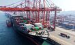 A cargo ship loads and unloads containers at Qingdao Port in Qingdao City, Shandong Provin...