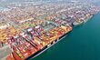 A cargo ship loads and unloads containers at Qingdao Port in Qingdao City, Shandong Provin...