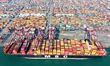 A cargo ship loads and unloads containers at Qingdao Port in Qingdao City, Shandong Provin...
