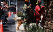 Rescuers take part in the national earthquake drill for a hypothetical 7.2 magnitude earth...