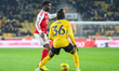 Bukayo Saka of Arsenal FC is in attacking action, marked by Mateus Mane of Wolverhampton W...