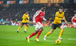 Bukayo Saka of Arsenal FC is in attacking action, followed by Santiago Bueno of Wolverhamp...