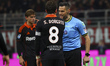 Maurizio Mariani and Sergi Roberto are in action during the Serie A match between AC Milan...