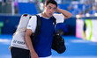Brandon Nakashima of the USA walks out of the court after his loss against Coleman Wong of...