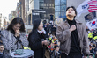 Supporters of former South Korean President Yoon Suk Yeol weep and pray for his acquittal...
