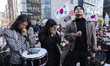 Supporters of former South Korean President Yoon Suk Yeol weep and pray for his acquittal...