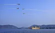 The Indian Air Force's (IAF) Sarang helicopters display team performs maneuvers over the J...