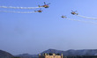 The Indian Air Force's (IAF) Sarang helicopters display team performs maneuvers over the J...