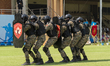 Personnel of the Valley QAT unit of the Central Reserve Police Force advance in shield for...