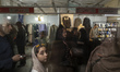 Iranian families visit the Iranian-Islamic fashion design fair held to commemorate the hol...
