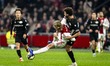 AFC Ajax Amsterdam forward Kasper Dolberg and NEC defender Philippe Sandler play during th...