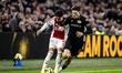 AFC Ajax Amsterdam midfielder Rayane Bounida and NEC defender Ahmetcan Kaplan play during...