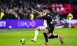 AFC Ajax Amsterdam defender Lucas Rosa and NEC forward Basar Onal play during the match be...