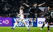 NEC midfielder Darko Nejasmic lands on the ankle of AFC Ajax Amsterdam forward Kasper Dolb...