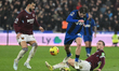 Alex Scott of AFC Bournemouth challenges Jarrod Bowen of West Ham United during the Premie...