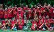 EA7 Emporio Armani Milano lifts the cup after winning the final match against Bertram Dert...