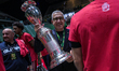 EA7 Emporio Armani Milano celebrates with the cup after winning the final match against Be...