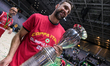 Giuseppe Poeta, head coach of EA7 Emporio Armani Milano, celebrates with the trophy after...