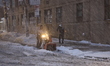 Workers clear the sidewalks on Sutton Place in New York, United States, on February 23, 20...