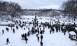 A New York family is in Central Park, Manhattan, on February 23, after the snowstorm passe...