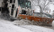 A snowplow clears city streets as blizzard conditions persist in New York City, United Sta...