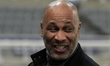Les Ferdinand stands before the UEFA Champions League Knockout Play-off Second Leg match b...