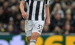 Dan Burn of Newcastle United participates in the UEFA Champions League Knockout Play-off S...