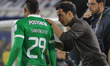 Diego Arias, manager of Atletico Nacional, speaks with Andres Sarmiento during the match b...