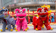 A traditional lion dance performance takes place as part of the traditional kick start of...