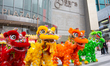 A traditional lion dance performance takes place as part of the traditional kick start of...