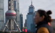 People walk at North Bund in Shanghai, China, on February 27, 2026. 