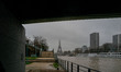 A metro train runs on the metal structure with a view of the Eiffel Tower in Paris, France...