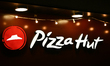 WARSAW, POLAND - FEBRUARY 26: An illuminated Pizza Hut sign and its distinctive red logo...
