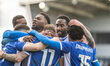 Jack Stevens of Oldham Athletic celebrates with his teammates after scoring during the Sky...