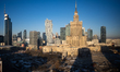 A very wide winter morning panorama shows the Palace of Culture and Science at the center...