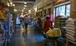 DOHA, QATAR - FEBRUARY 18:  Porters in red vests push wheelbarrows filled with goods thro...