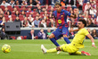 Lamine Yamal dribbles Renato Veiga and scores during the match between FC Barcelona and Vi...
