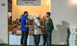 DOHA, QATAR - FEBRUARY 18:  A group of men gather to discuss date varieties at a stall re...
