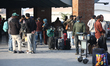 Stranded Nepali migrant workers wait for an update from the airline company at Tribhuvan I...