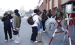 Nepali migrant workers wait in the Tribhuvan International Airport after several Middle Ea...