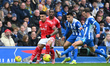 Pascal Gross of Brighton closes in on Igor Jesus of Nottingham Forest during the Premier L...