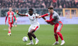 Youssouf Fofana of AC Milan contrasts with Jari Vandeputte of US Cremonese during the Seri...