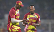 Matthew Forde of West Indies is with Jason Holder of West Indies during the ICC Men's T20...
