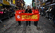Chinese civic leaders march in the Chinese New Year parade in the streets of Chinatown in...