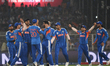 India's Jasprit Bumrah celebrates with teammates the wicket of West Indies' Shimron Hetmye...