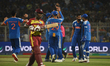 India's Hardik Pandya celebrates with teammates the wicket of West Indies' Sherfane Ruther...