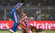 Jasprit Bumrah of India attempts to run out Jason Holder of West Indies during the T20 Wor...