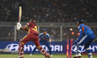 West Indies' captain Shai Hope is clean bowled by India's Varun Chakravarthy during the T2...