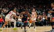 KK Arnold #2 of the UConn Huskies drives to the basket past Daniela Abies #16 of the St. J...